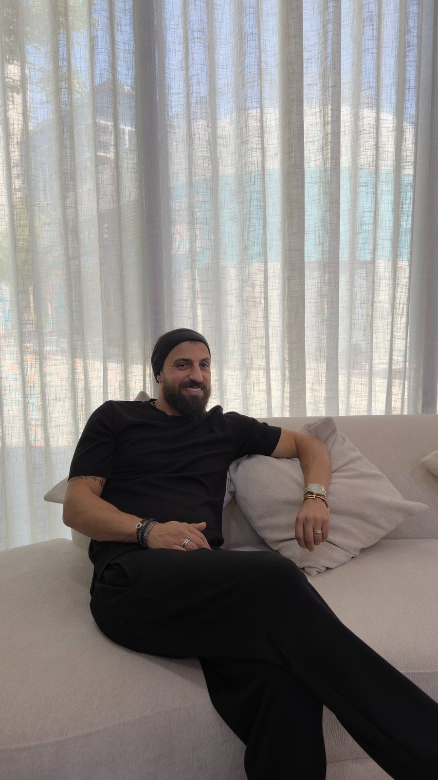 Haitham Labban relaxing on a sofa in the lounge of Haitham Labban Beauty Salon, Manama